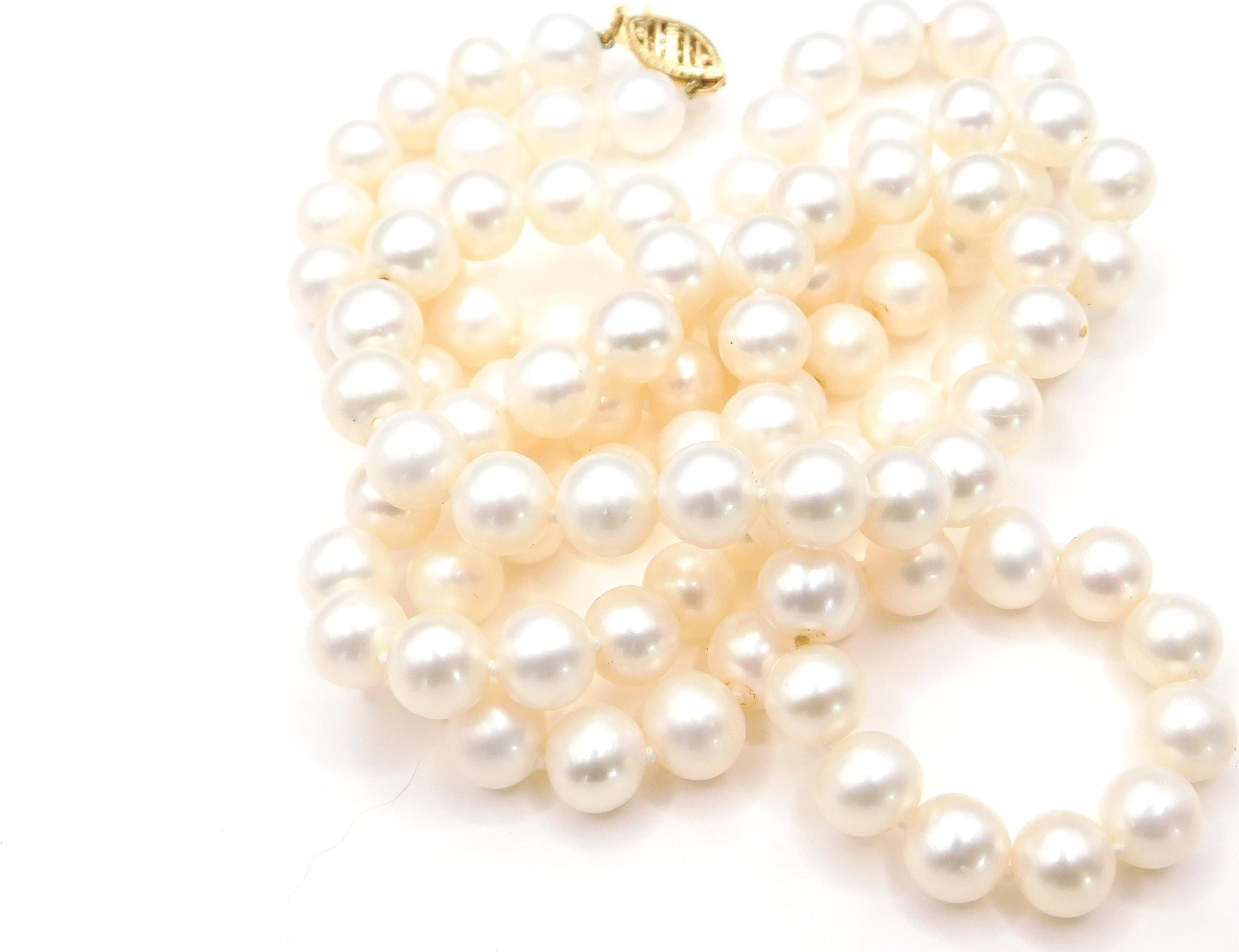 LUSTROUS CULTURED PEARL STRAND WITH 14K GOLD FILIGREE CLASP