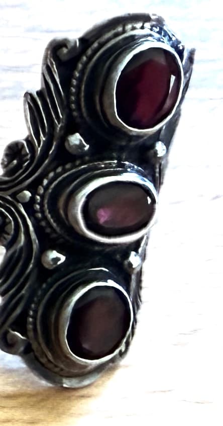 ORNATE TRIBAL SILVER RING WITH THREE FACETED GARNET-COLORED STONES
